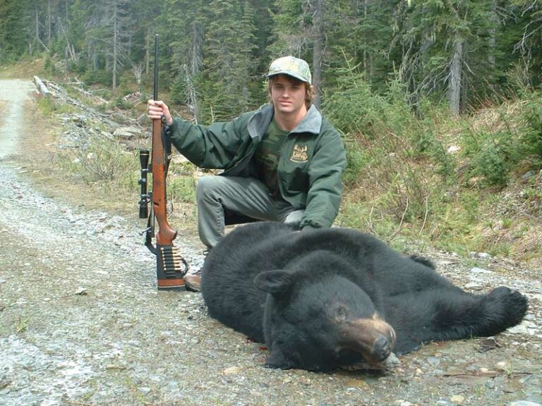 rifle-hunter-with-black-bear